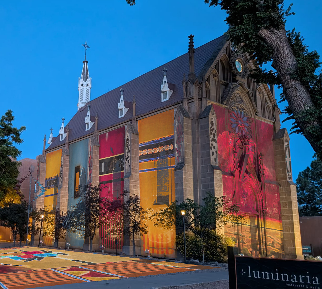 Poteet Victory's paintings projected on Loretto Chapel, Santa Fe — concept render